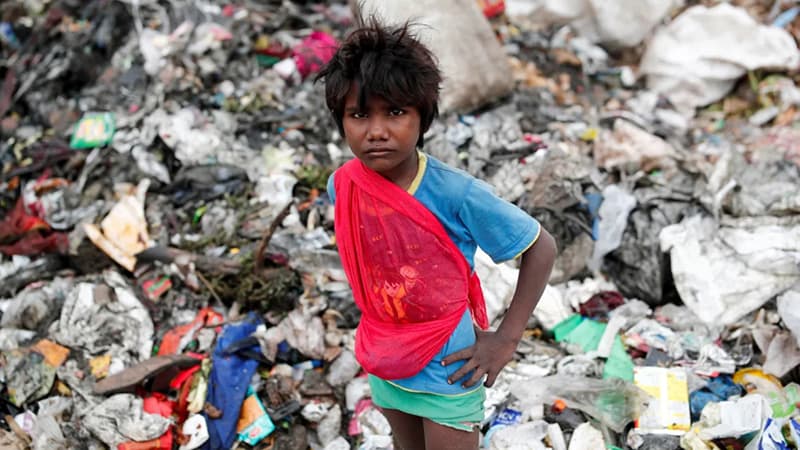 A Bradford child plays among the rubbish